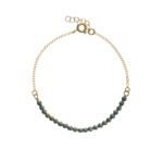 Pulsera de plata de ley bañada en oro con cristales.